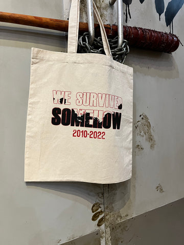We Survived Somehow Tote Bag